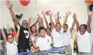  ??  ?? DJ Denvo and his student DJs at Reach Academy are in high spirits during the Kids Mix DJ Club at the institutio­n recently.