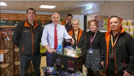  ?? ?? TEN YEARS DOWN: John Healey MP with Owen McLellan, managing director, Coun Abi Moore, store manager Mark Howorth, supervisor Gareth Pridham and shopworker Gill Murch.