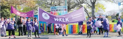  ??  ?? Banner held high, the memory walkers leave Levin Adventure Park.