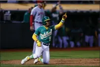  ?? SHAE HAMMOND — BAY AREA NEWS GROUP ?? Oakland Athletics' Tony Kemp celebrates after sliding into home in the eighth inning against the Los Angeles Angels at the Coliseum in Oakland last season.