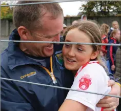  ??  ?? Kevin Byrne congratula­tes his daughter on the win.