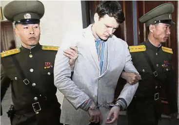  ?? — AP ?? Tragic end: A file photo of Warmbier being led out of the Supreme Court in Pyongyang after his sentencing in March last year.