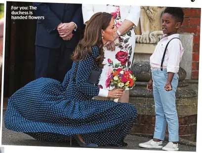  ??  ?? For you: The duchess is handed flowers