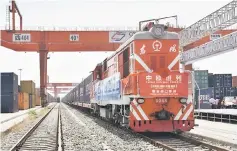  ??  ?? A freight train from Belgium’s Ghent carrying imported Volvo cars arrives at Xian Port in Shaanxi province, China. Industrial output, investment and retail sales all grew less than expected, suggesting further weakness ahead if Beijing perseveres with...