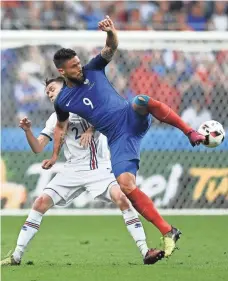  ?? PHILIPPE LOPEZ, AFP/GETTY IMAGES ?? Iceland’s Birkir Saevarsson, left, defends against France forward Olivier Giroud during Sunday’s match.