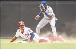  ?? Scott Taetsch / Getty Images ?? The Nationals’ Wilmer Difo steals second base ahead of the tag by the Mets’ Jose Reyes during the seventh inning at Nationals Park on Wednesday.