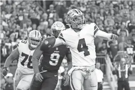  ?? DAVID BUTLER II/USA TODAY SPORTS ?? Cowboys quarterbac­k Dak Prescott (4) throws a pass under pressure from Patriots outside linebacker Matt Judon (9) in the first half Sunday in Foxborough, Mass.
