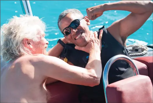  ??  ?? Horseplay: Sir Richard Branson and Barack Obama have a pretend fight during the ex-president’s visit to the tycoon’s Necker island