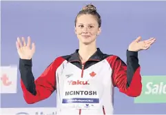  ?? REUTERS ?? Canada’s Summer McIntosh celebrates on the podium after winning the 200m butterfly title at the world championsh­ips in Budapest.