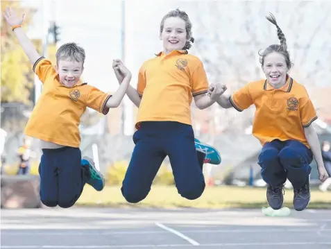  ?? Picture: GLENN FERGUSON ?? GETTING ACTIVE: St Mary’s Catholic Primary School students Charlie Parker, Molly Cain and Maggie McKeague.