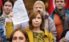  ?? Photograph: Liam McBurney/PA ?? Linda Ervine holds a copy of a letter calling for urgent progress on Irish language legislatio­n in Westminste­r.
