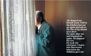  ?? Pictures: EUGENE COETZEE ?? KEEPING WATCH: One of the victims, who did not want to be named, looks outside from her ground floor flat at the Buffelsfon­tein Village old age home