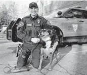  ?? ?? Rhode Island State Police Cpl. Daniel O’Neil is seen Feb. 16 with his partner, Ruby, a state police K-9.