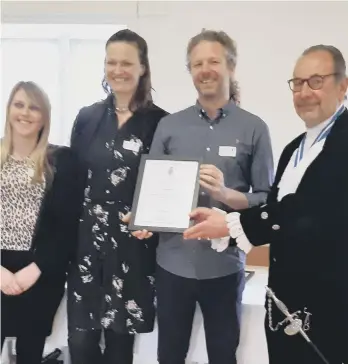  ?? ?? Neal Allistone, Alice Field and Laura Bothwell from thechildre­n’s charity Spurgeons receiving their award