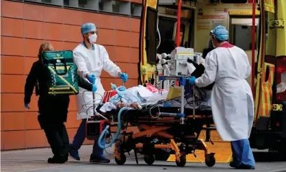  ??  ?? Medics take a patient from an ambulance into the Royal London hospital. Imperial scientists think their survey may be ahead of official figures. Photograph: Tolga Akmen/AFP/Getty Images