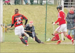  ??  ?? Kinlochshi­el keeper Scott Kennedy stays calm under pressure.