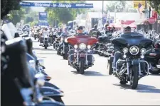  ?? JOSH MORGAN — RAPID CITY JOURNAL VIA AP, FILE ?? In this Aug. 5, 2016 file photo, bikers ride down Main Street in downtown Sturgis, S.D., before the 76th Sturgis motorcycle rally officially begins.