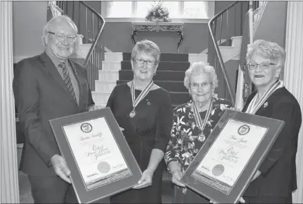  ?? SALLY COLE/SALTWIRE WIRE ?? Premier Wade MacLauchla­n and Lt.-Gov. Antoinette Perry, right, congratula­te Heather Cutcliffe, second left, and Irene Jewell, the newest members of the Order of Prince Edward Island, following the investitur­e ceremony at Government House on Wednesday.