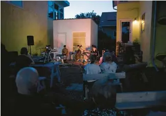  ?? JAMES C. SVEHLA/CHICAGO TRIBUNE ?? Cellist Lia Kohl plays with one of her groups, Honestly Same, as part of Compound Yellow’s Side Yard Sounds series in Oak Park.