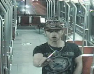  ?? THE CANADIAN PRESS ?? Sammy Yatim holds a knife on a Toronto streetcar on July 26, 2013, in this image from a surveillan­ce video. Police Const. James Forcillo was found guilty of attempted murder in the fatal shooting of Yatim.