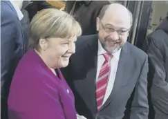  ??  ?? 0 Mrs Merkel and Social Democrat leader Martin Schulz yesterday