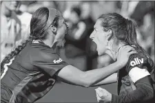  ?? JEFF DEAN/AP PHOTO ?? Washington Spirit captain Andi Sullivan, right, celebrates with Ashley Hatch after scoring on a penalty kick during the second half of the NWSL Championsh­ip game against the Chicago Red Stars on Saturday in Louisville, Ky. The Spirit won 2-1 in extra time.