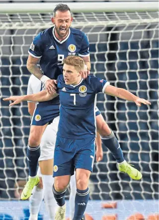  ?? Pictures: SNS/PA. ?? Left: James Forrest completes his hat-trick; above: the goal hero is congratula­ted by Steven Fletcher; right, top: Allan McGregor pulls off a stunning save to deny Tomer Hemed a late equaliser; and Ryan Fraser feels the full force of a Sheran Yeini challenge.