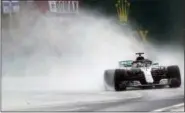  ?? LASZLO BALOGH — THE ASSOCIATED PRESS ?? Mercedes driver Lewis Hamilton of Britain steers his car during the qualifying session for the Hungarian Formula One Grand Prix, at the Hungarorin­g racetrack in Mogyorod, northeast of Budapest, Saturday. The Hungarian Grand Prix will be held on Sunday.