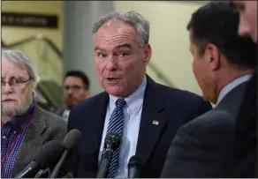  ?? AP Photo/Susan Walsh, File ?? Healthcare: In this April 7, 2017, file photo, Sen. Tim Kaine, D-Va., center, speaks to reporters on Capitol Hill in Washington. Democrats say they’re shifting to offense on health care, emboldened by successes in defending the Affordable Care Act....