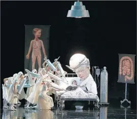  ??  ?? THE COSTUMES and set, designed by Pop Surrealist Mark Ryden, are lavishly whimsical, with a hospital room setting that’s both detailed and fearsome.