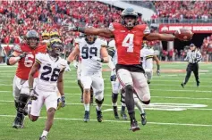  ?? GREG BARTRAM/ USA TODAY SPORTS ?? Ohio State running back Curtis Samuel scores the winning TD in the second OT against Michigan in 2016 at Ohio Stadium.