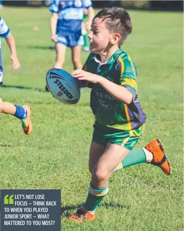  ?? Picture: BRONWYN WHEATCROFT ?? WINNING: Mareeba Junior Rugby League under-9s player Konway Johns-Taliaoa runs with the ball in a match against Cairns Brothers.