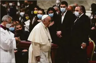  ?? Alessandra Tarantino / Associated Press ?? Pope Francis walks past Melitopol Mayor Ivan Fedorov, second from right, and Ukrainian lawmakers during a Easter vigil ceremony in St. Peter's Basilica at the Vatican on Saturday.