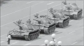  ??  ?? In this iconic June 5, 1989 photo, a man is seen standing in front of tanks at Tiananmen Square.