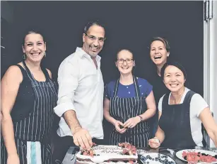  ??  ?? Made simple . . . Yotam Ottolenghi with his team of recipe writers, testers and tasters.
