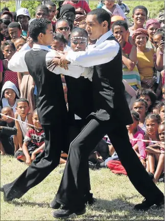  ?? Picture: BRIAN WITBOOI ?? CULTURAL CELEBRATIO­NS: TLC Ballroom dancers, from left, Le-Cane Hatthies, Tess Ellison and Cuan Prins perform at the Northern Culture and Heritage Festival at Helenvale Primary School