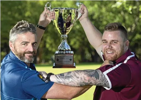  ?? PHOTO: KEVIN FARMER ?? GAME ON: Leading the fight to win the inaugural Brett Forte Cup is Toowoomba Police team captain Senior Constable Terry Brighton (left) and Australian Defence Force team captain Leading Seaman William Scott.