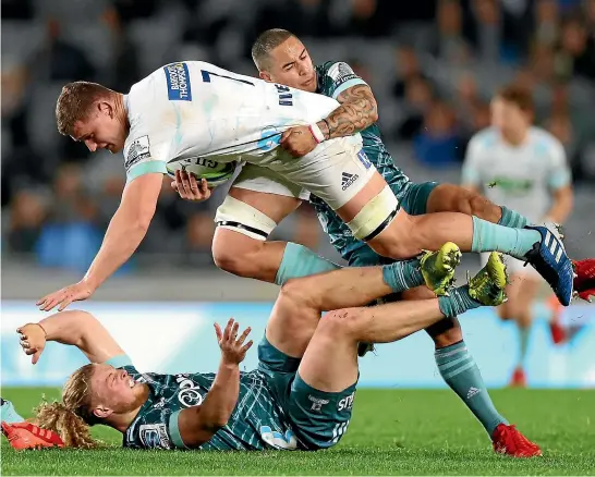  ?? GETTY IMAGES ?? Aaron Smith, top, tackles Blues flanker Dalton Papalii during a typically bruising Super Rugby Aotearoa derby match at Eden Park last Saturday.