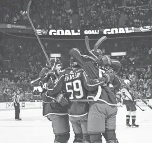  ?? NICOLAS GALINDO/THE COLUMBUS DISPATCH ?? The Blue Jackets celebrate after defenseman Gabriel Carlsson’s goal against Colorado on Nov. 6.