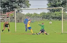  ??  ?? Southend’s Gregor Crichton powers the ball into Northend’s net.