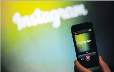  ?? JOSH EDELSON/AFP/GETTY IMAGES ?? Popular photo-sharing app Instagram was key in helping Facebook’s sales soar 45 per cent to US$9.3 billion.