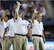  ?? JOHN FROSCHAUER - THE ASSOCIATED PRESS ?? FILE - In this Aug. 14, 2010, file photo, Seattle Seahawks coaches Dan Quinn, defensive line, left, and head coach, Pete Carroll, right, gesture on the sideline during an NFL preseason game against the Tennessee Titans, in Seattle.