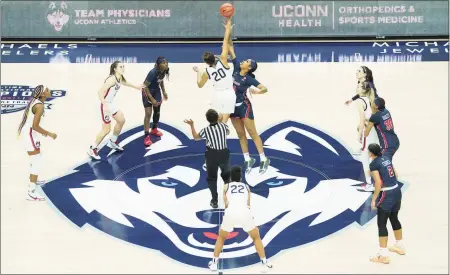  ?? David Butler II / USA Today / Pool / Contribute­d Photo ?? The UConn Huskies tip-off against the St. John’s Red Storm at Harry A. Gampel Pavilion in Storrs on Feb. 3.