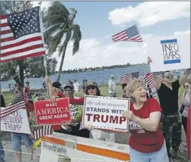 ?? AP PHOTO ?? Supporters of President Donald Trump gather outside Mar-a-Lago in Palm Beach, Fla. Trump turned to Congress on Sunday for help finding evidence to support his unsubstant­iated claim that former President Barack Obama had Trump’s telephones tapped during...