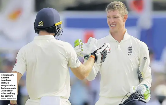  ?? Eranga Jayawarden­a ?? England’s Keaton Jennings, right, is congratula­ted by team-mate Jos Buttler after making his century