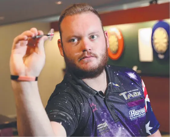  ?? Picture: RICHARD GOSLING ?? Gold Coast pro darts player Robbie King in action at Southport yesterday.