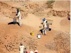  ??  ?? Illegal diamond miners known locally as “zama-zamas” are seen from the air as they work in South Africa (Reuters)