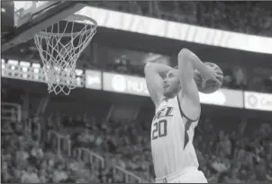  ?? The Associated Press ?? ON THE MOVE?: Utah Jazz forward Gordon Hayward, here going up for a dunk against the Brooklyn Nets during a March 3 game, meets with the Miami Heat on Saturday as the NBA free-agency period begins.