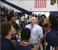  ?? TIM PHILLIS — FOR THE NEWS-HERALD ?? Euclid boys basketball coach T.J. Kwasniak celebrates after his team won the Solon District on March 9.