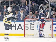  ?? USA TODAY SPORTS ?? Bruins centre Patrice Bergeron, left, celebrates after scoring past Rangers goaltender Henrik Lundqvist.